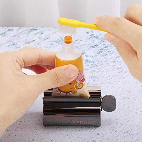 XYKEEY Toothpaste Tube Squeezer - Set of 2 Toothpaste Squeezer Rollers, Metal Toothpaste Tube Wringer Seat Holder Stand (Black)