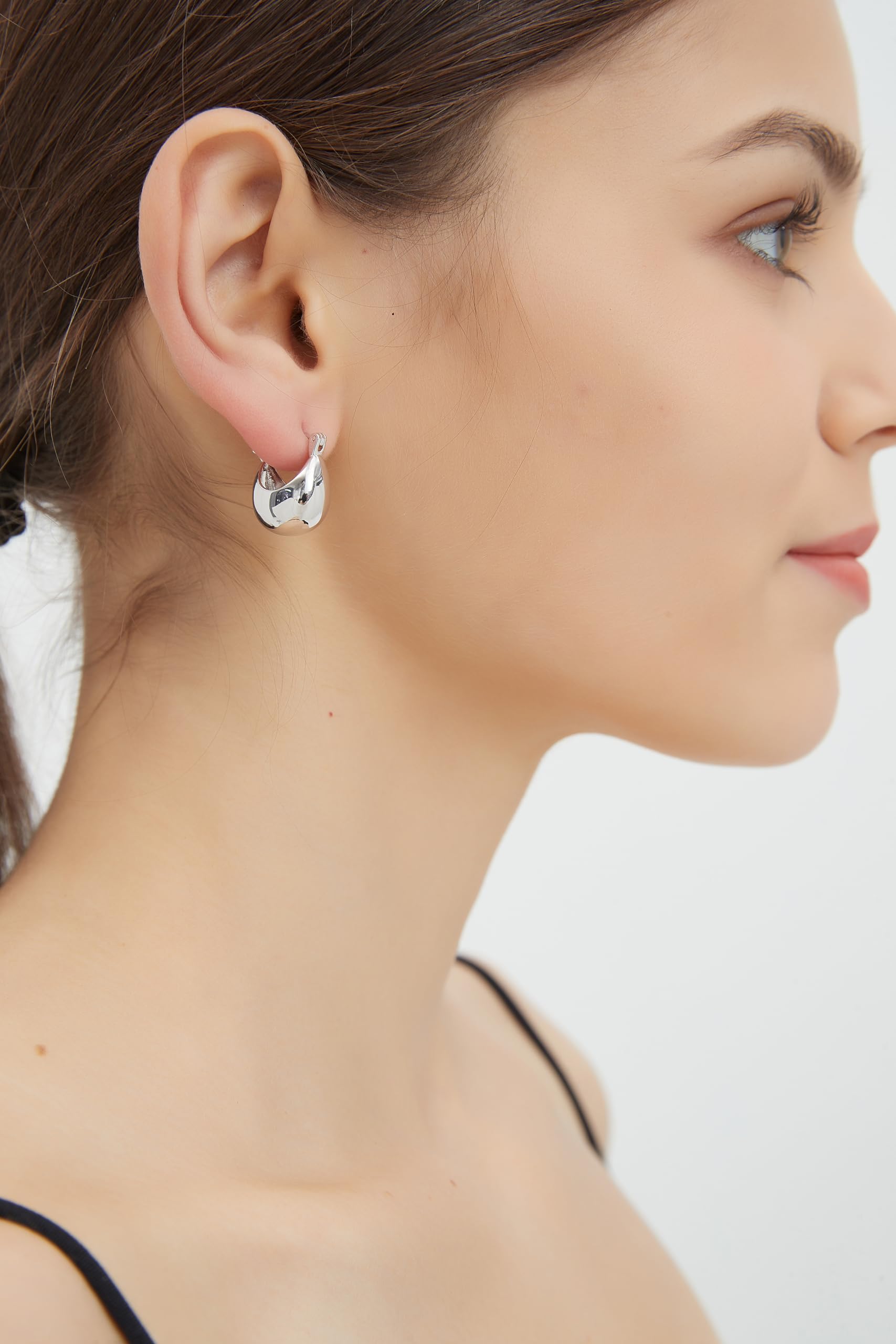 IELEGLOWS Small Chunky Huggie Hoops | Rhodium Plated Sterling Silver Huggy Earrings | Hollow Dome Hoops for Women (White Rhodium)