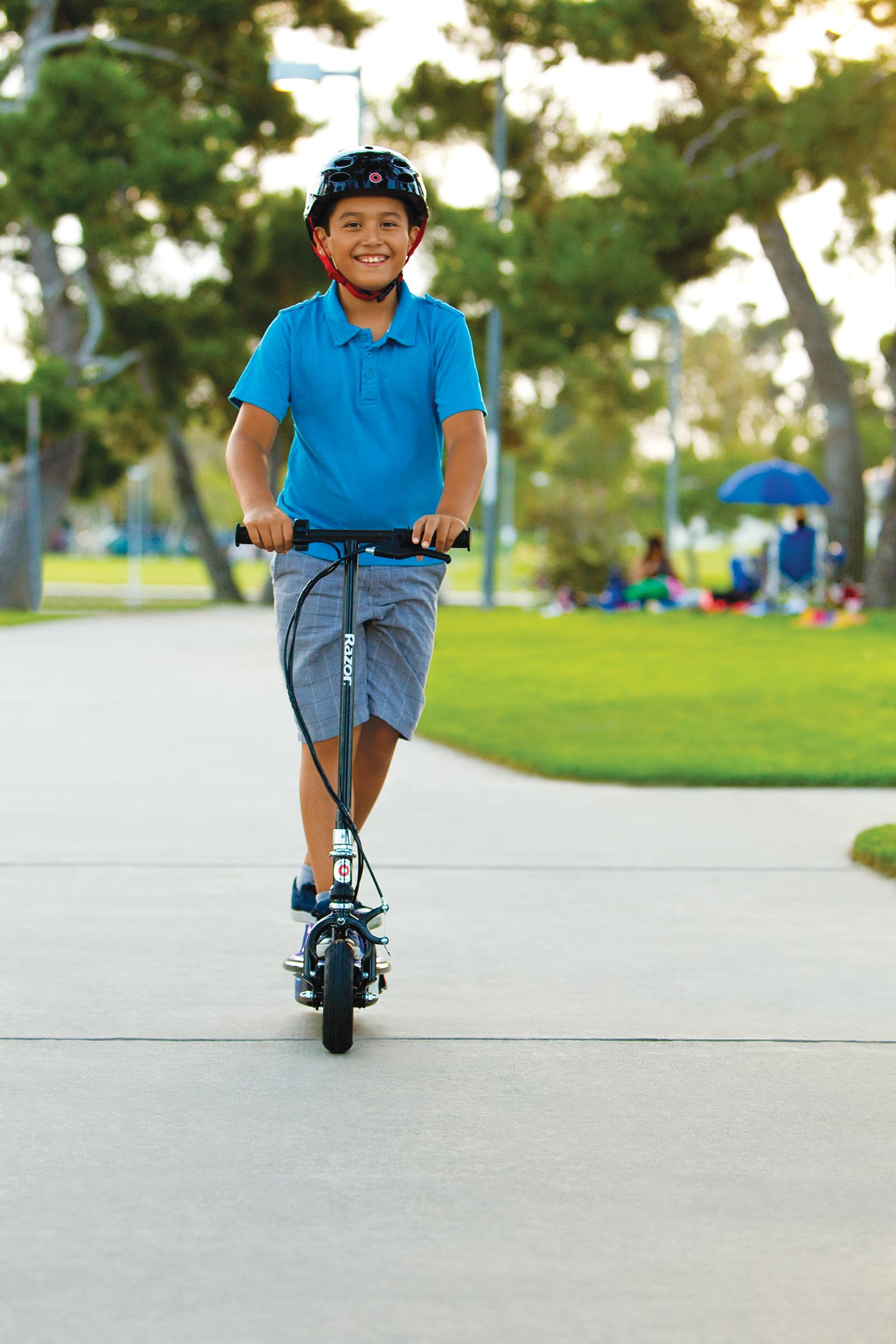 Razor E100 Glow Electric Scooter for Kids Age 8 and Up, LED Light-Up Deck, 8" Air-filled Front Tire, Up to 40 min Continuous Ride Time
