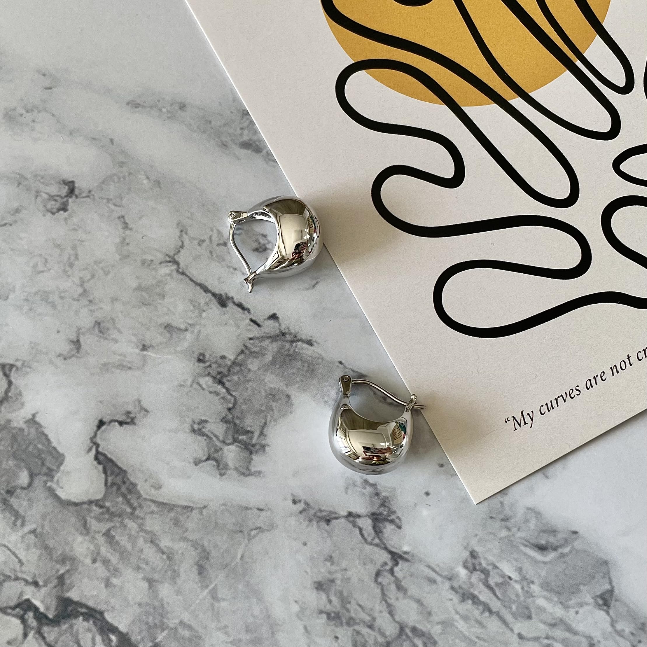 IELEGLOWS Small Chunky Huggie Hoops | Rhodium Plated Sterling Silver Huggy Earrings | Hollow Dome Hoops for Women (White Rhodium)