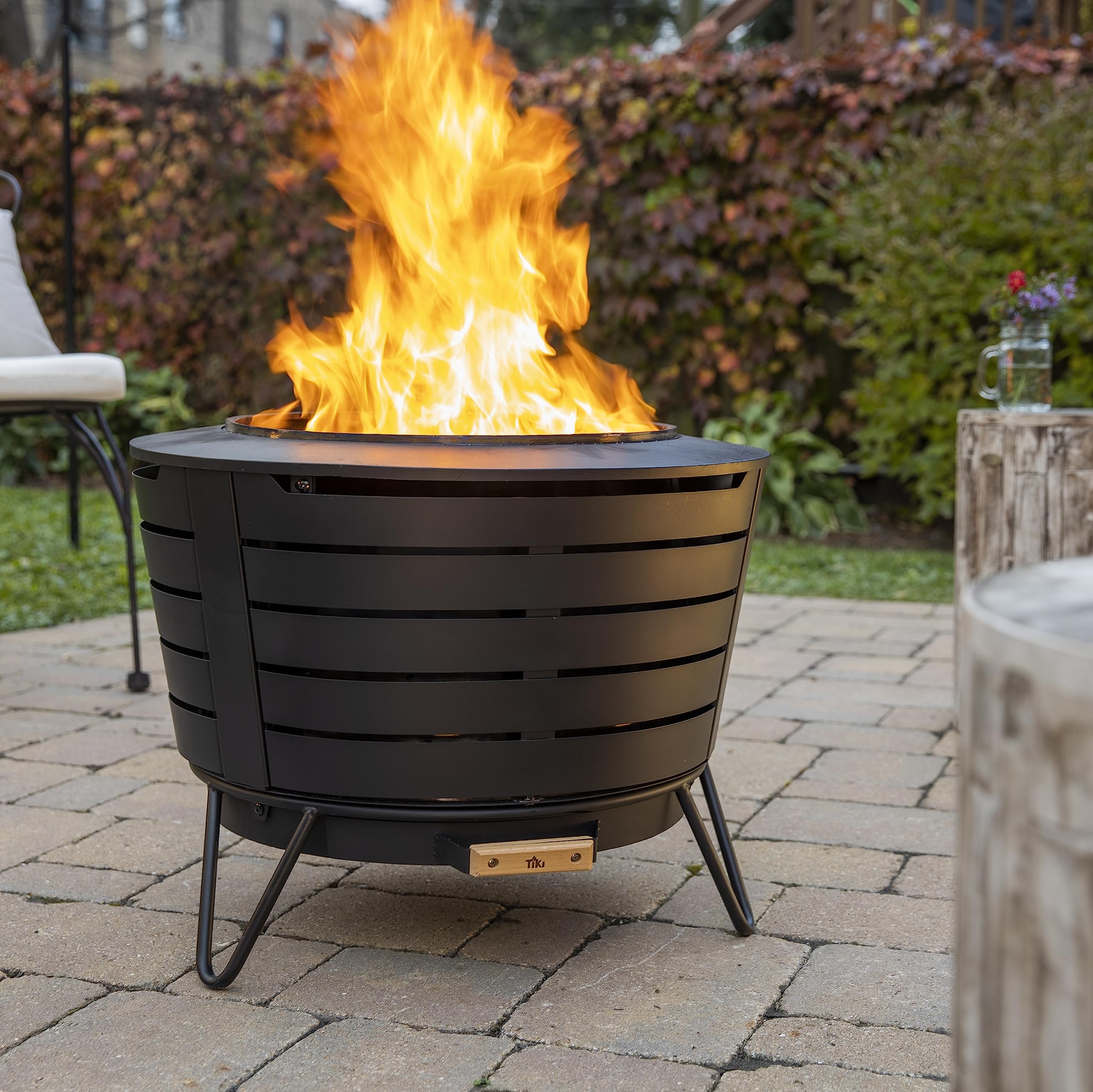 TIKI Patio Fire Pit Bundle – 25-Inch Smokeless Wood Burning Outdoor Fire Pit for Backyard, Patio, Deck & Garden with Removable Ash Pan, Stand & Weather-Resistant Cover – Modern Black Stainless Steel