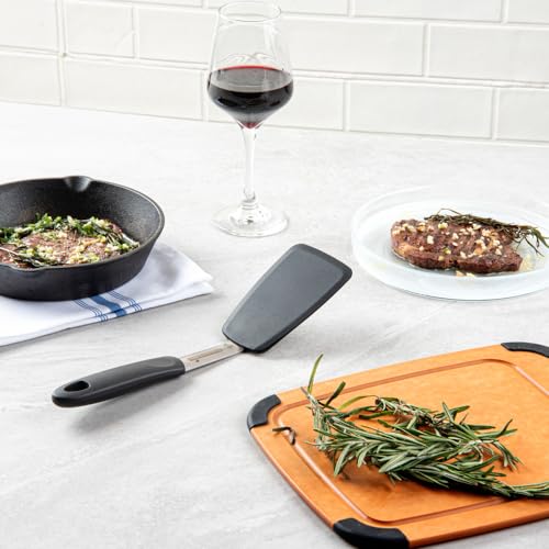 Restaurantware Comfy Grip 12 x 3 Inch Silicone Turner 1 Durable Cooking Turner - Stainless Steel Body Rubber Handle With Hole Black Silicone Flipper Spatula Tolerates Up To 446F Dishwashable