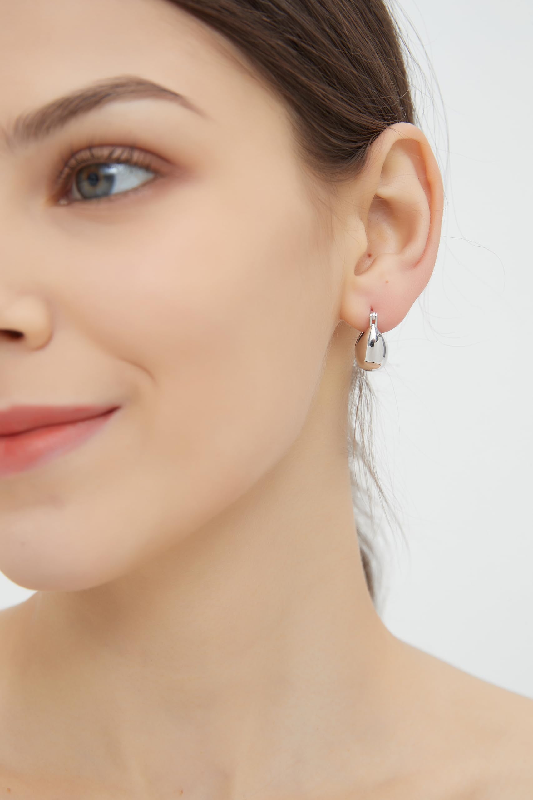 IELEGLOWS Small Chunky Huggie Hoops | Rhodium Plated Sterling Silver Huggy Earrings | Hollow Dome Hoops for Women (White Rhodium)