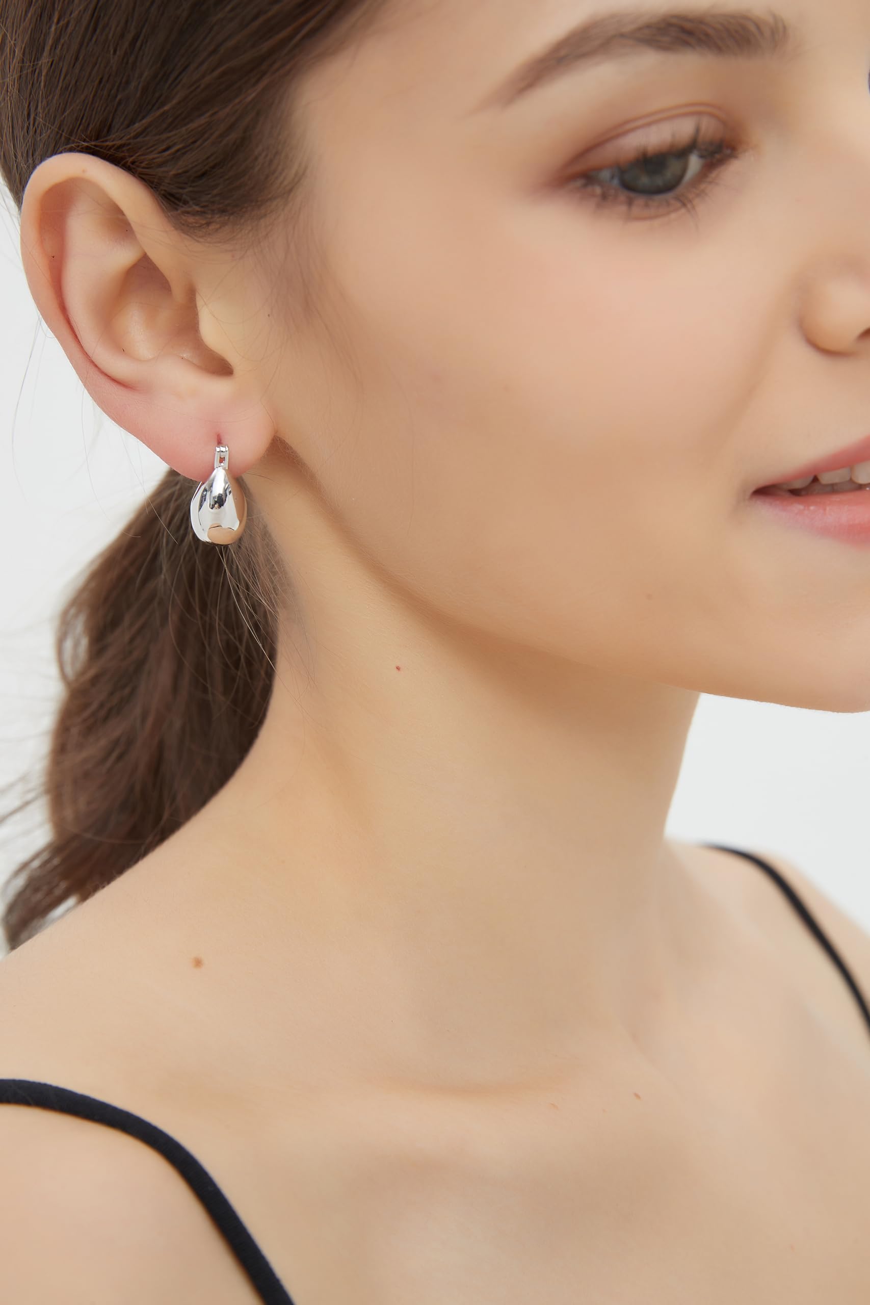 IELEGLOWS Small Chunky Huggie Hoops | Rhodium Plated Sterling Silver Huggy Earrings | Hollow Dome Hoops for Women (White Rhodium)