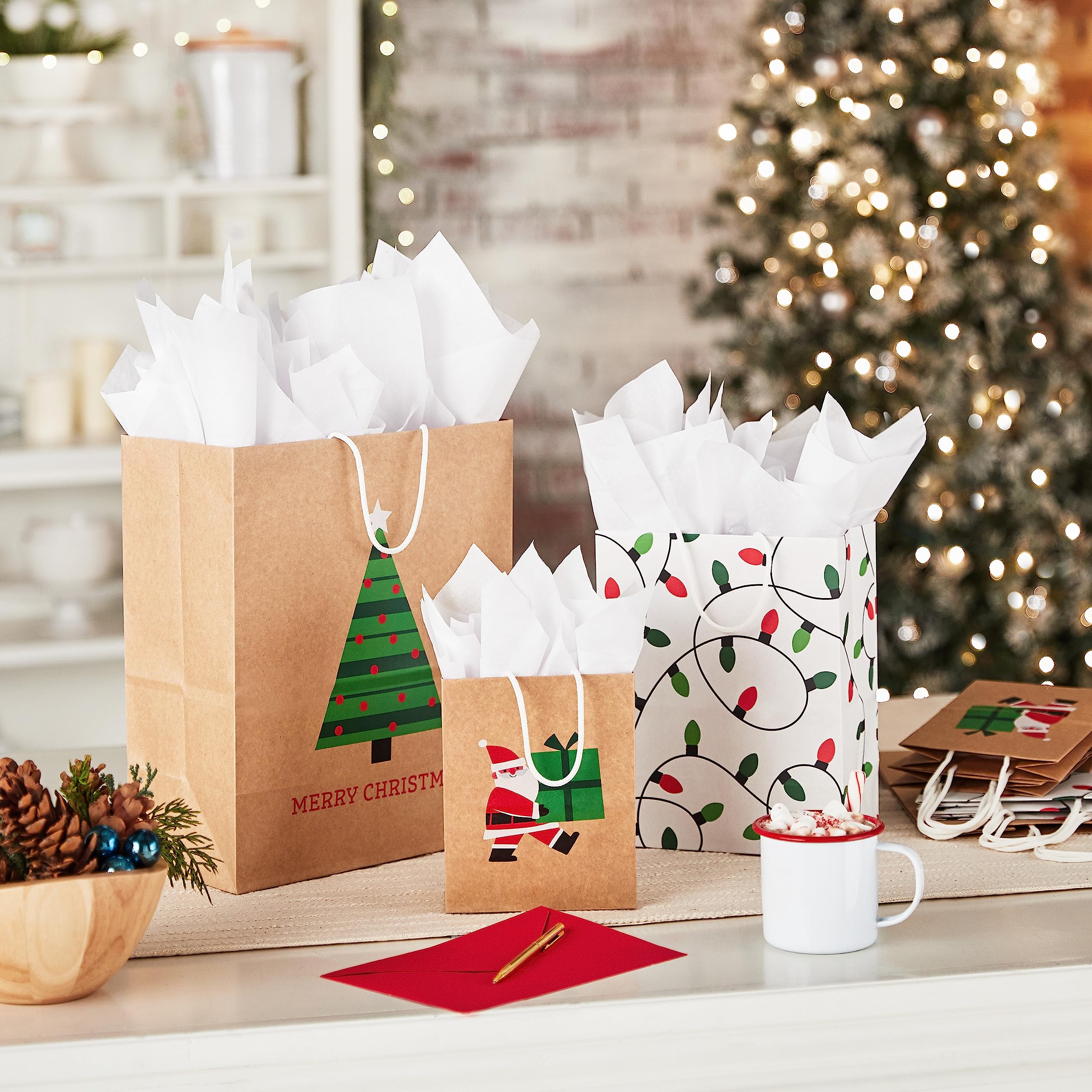 Hallmark Christmas Gift Bags for Kids (8 Bags: 3 Small 6", 3 Medium 9", 2 Large 13") Recyclable Kraft with Santa, Lights and Tree