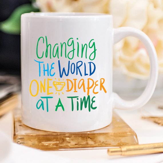 "Changing The World One Diaper at a Time" Mug