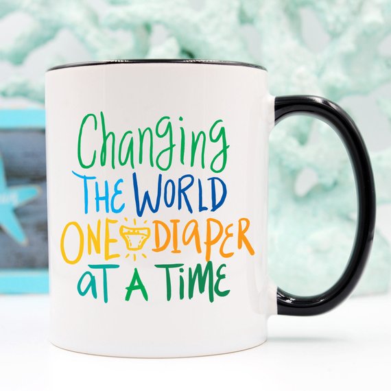 "Changing The World One Diaper at a Time" Mug