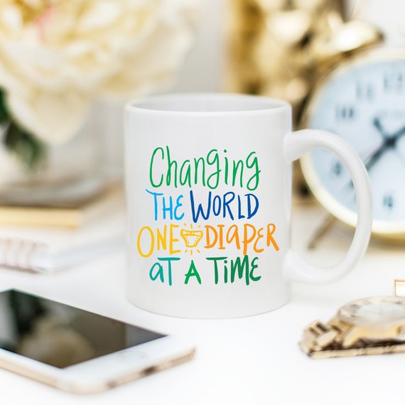 "Changing The World One Diaper at a Time" Mug