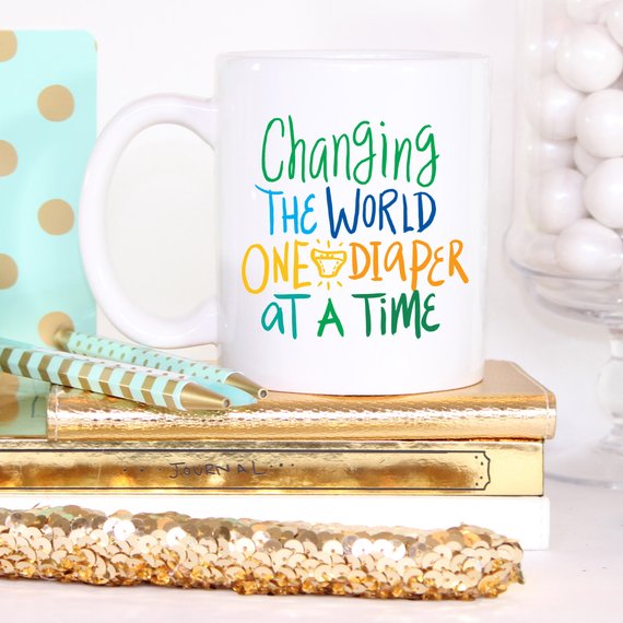 "Changing The World One Diaper at a Time" Mug