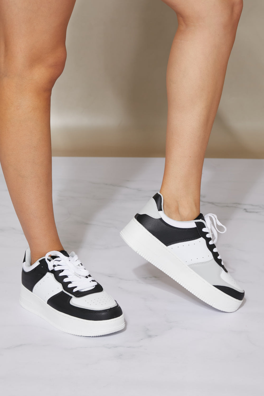 Mile a Minute Platform Sneakers in Black and White